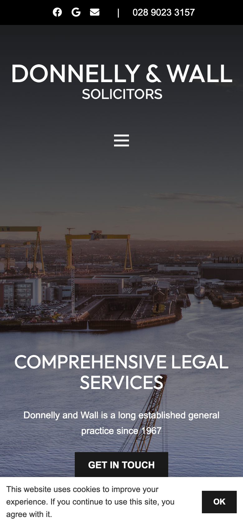 Donnelly & Wall website on mobile, designed by Web Design Belfast